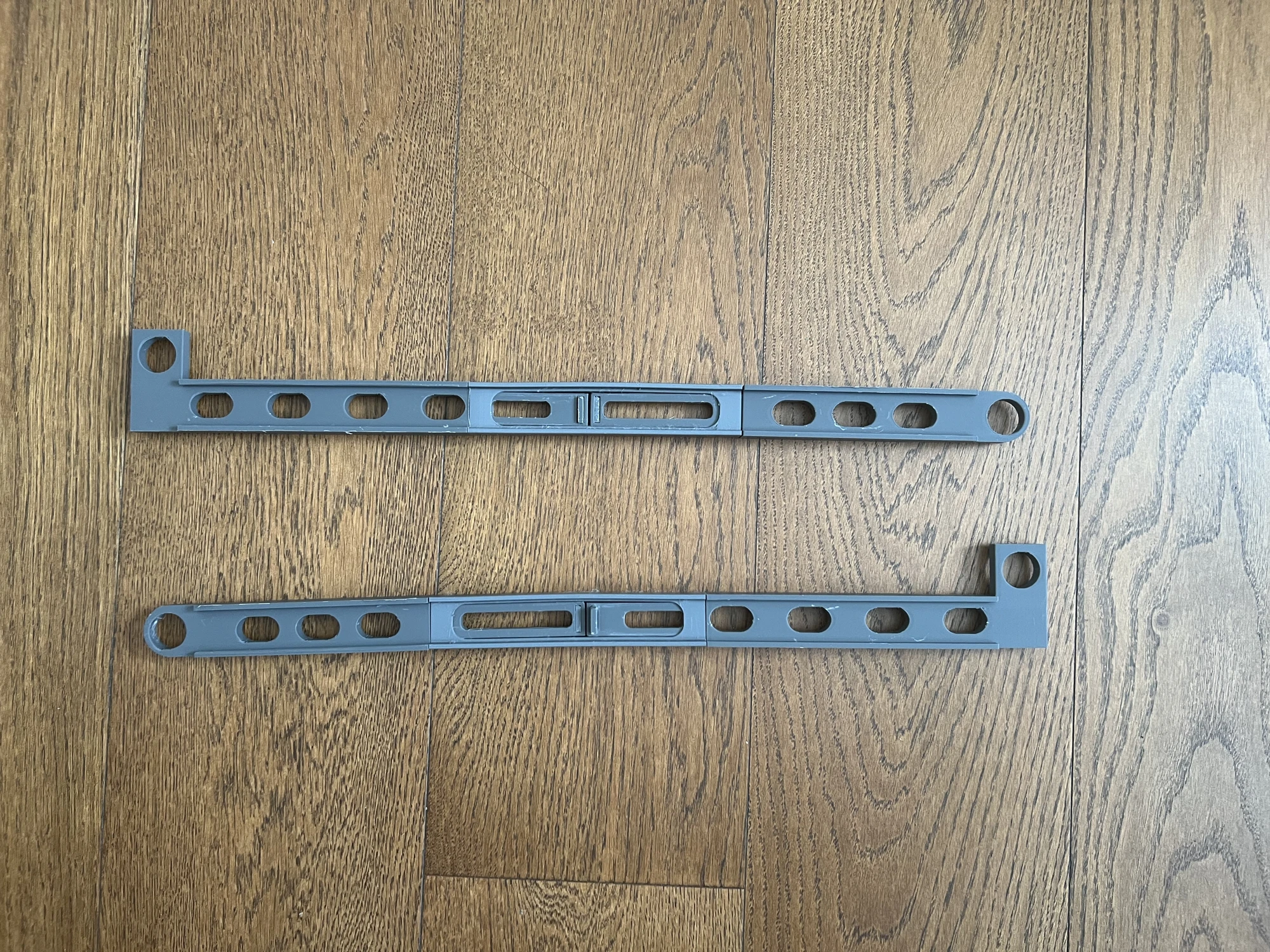 Final parallel arms with additional weight-reducing cutouts through their middle sections
