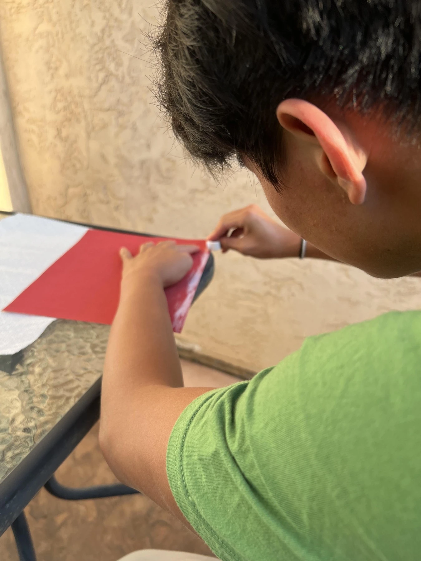 Preparing a red sheet at a work table