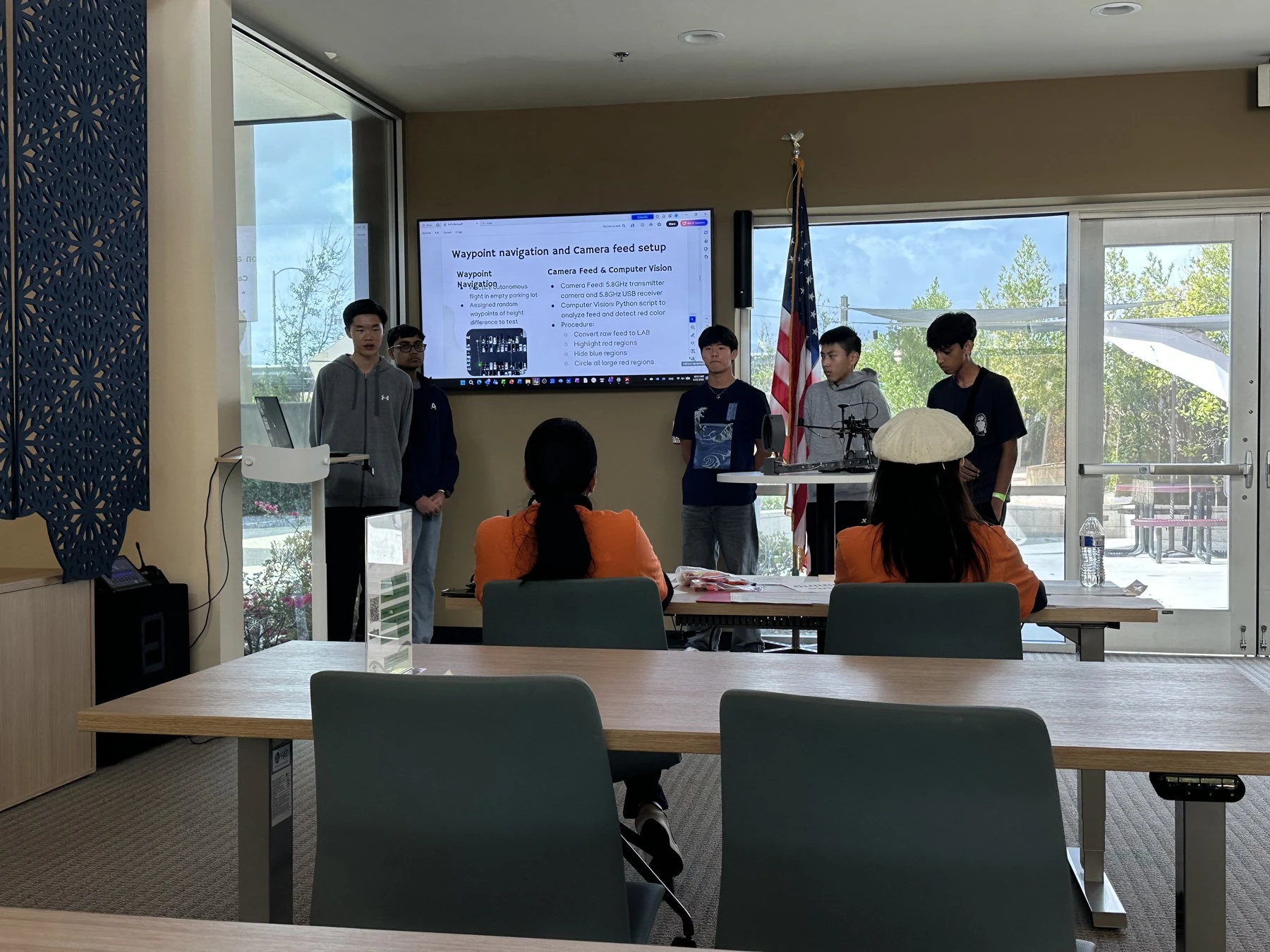 Team presenting the drone project indoors
